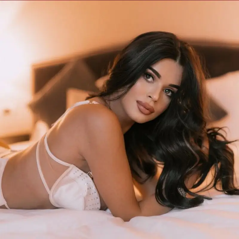 Lara Charm smiling during a live cam show